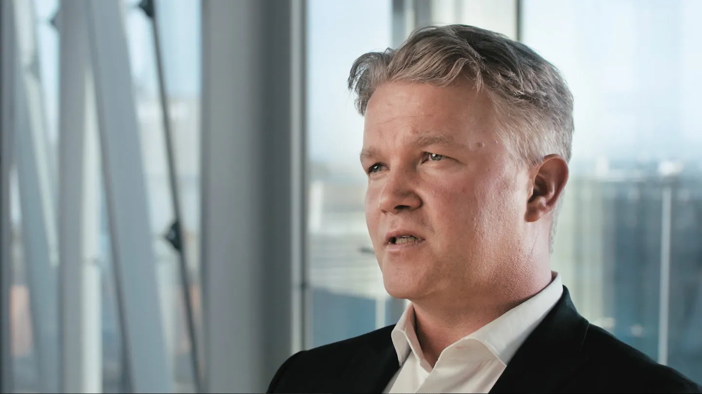 Interview in front of large windows